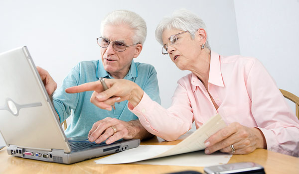 couple working together on a laptop computer