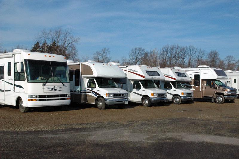 RVs in a row at a dealership sales lot